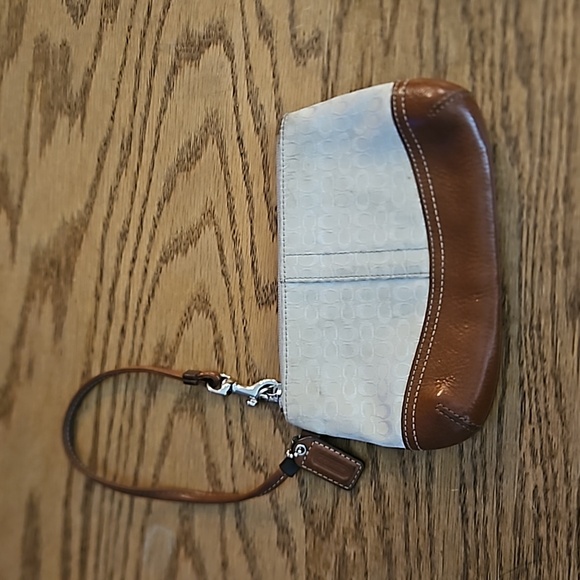 Coach Handbags - Coach Cream Signature wristlet with brown leather trim